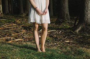 woman wearing white knee length dress
