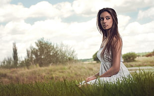 photography of woman on grass during day time