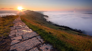 brown and white wooden bed frame, hills, path, clouds, horizon