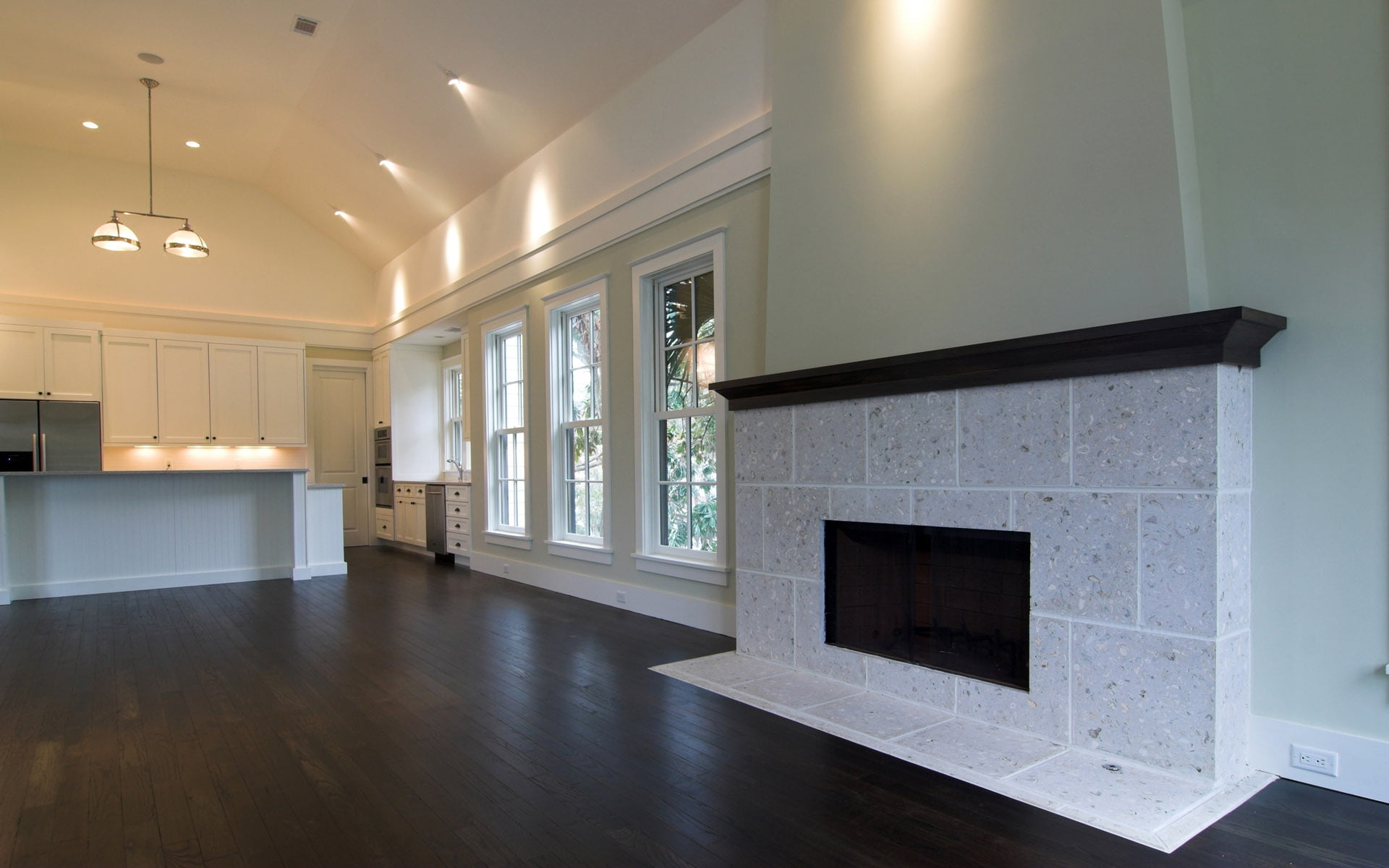 gray brick fireplace mantel placed inside white painted room