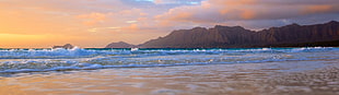 photo of ocean waves near seashore during sunset