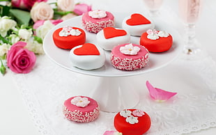 cupcakes filled with cream toppings in cake stand