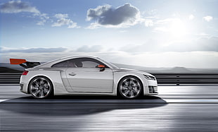 white sports car travels on road during daytime HD wallpaper