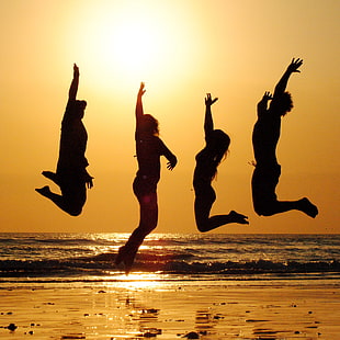 silhouette of four person jumping near beach HD wallpaper