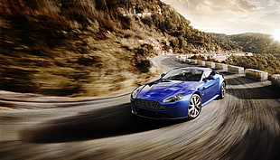 cornering blue Aston Martin Vantage in timelapse photography