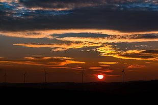 black wind turbine during sunset HD wallpaper