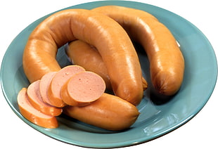 sausage on green glass plate