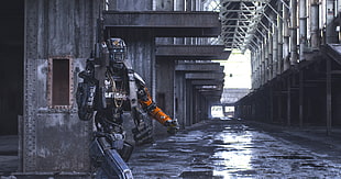 robot holding gun during daytime