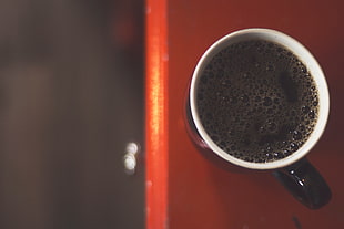 shallow focus photography of coffee mug