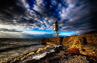 grey watchtower, beach, lighthouse, England, sea