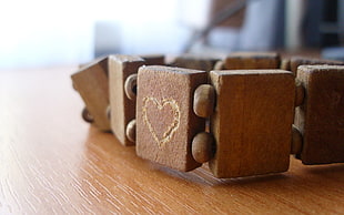 brown beaded bracelet on brown table