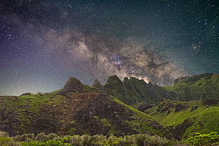 green mountains under sky full of stars HD wallpaper