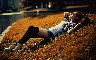 woman lying on brown grass field HD wallpaper