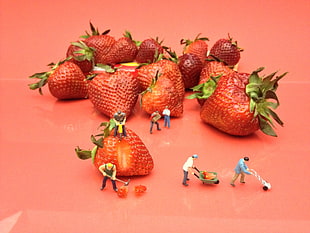 strawberry fruit on pink wooden table