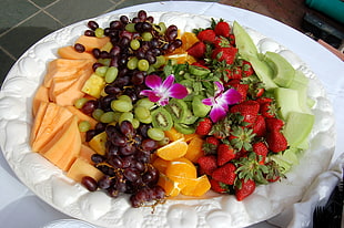 assorted fruits on round white ceramic plate