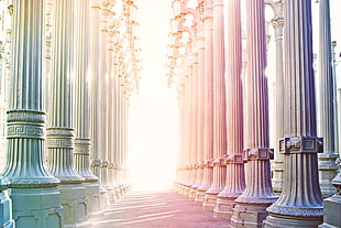 gamma photography of pink, gray and  teal concrete pillars during sunset
