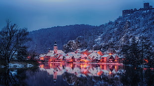 lighted house near body of water taken at nighttime, Germany, Bavaria, winter