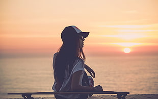 woman in white top sunset seing