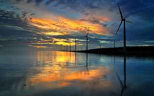 windmills, sunset, nature, reflection, wind turbine HD wallpaper
