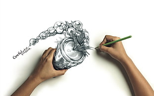 person drawing 3D can artwork