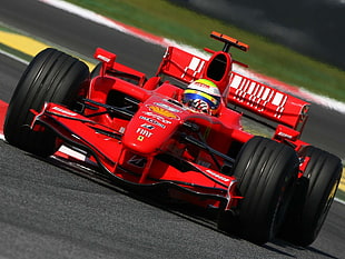 man riding in red F1