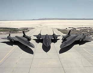 three jet fighter on aircraft during daytime