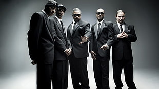 five men in black formal attire