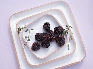 ripe berry in square white ceramic plate