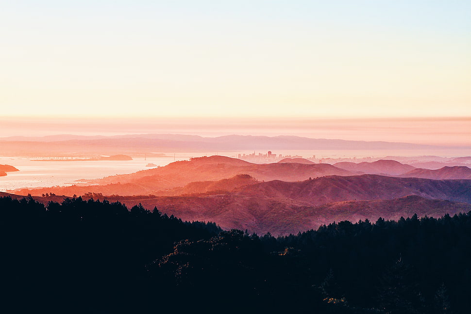 mountain range during pink sunset HD wallpaper