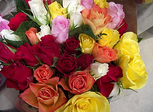 closeup photo of yellow, pink, and red petaled artificial flowers