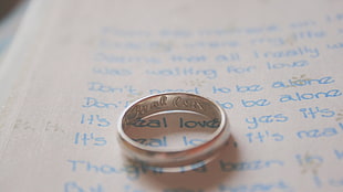silver-colored engrave ring