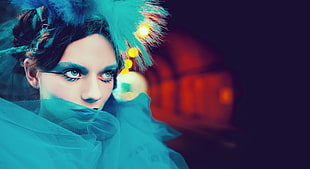 fashion photography of person wearing teal tulle dress and headpiece