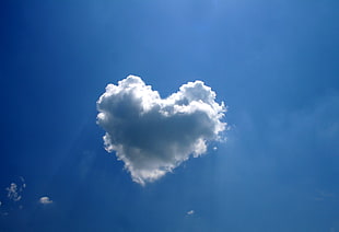 white cumulus clouds forming heart shape