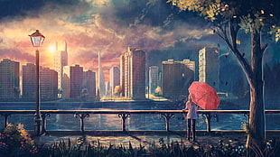 woman using pink umbrella watching the body of water and buildings