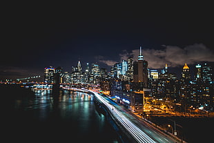 time lapse photography of city skyline at night