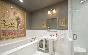white pedestal sink with sink on the wall