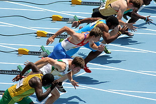 timelapse photo of men on track and field HD wallpaper