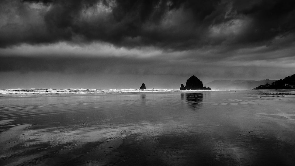 grayscale of sea and rock formation HD wallpaper