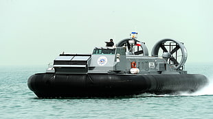 grey and black floating ship, hovercraft