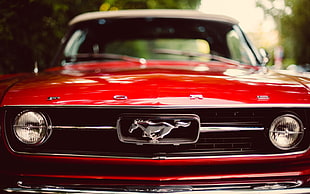 selective focus photography of red Ford Mustang