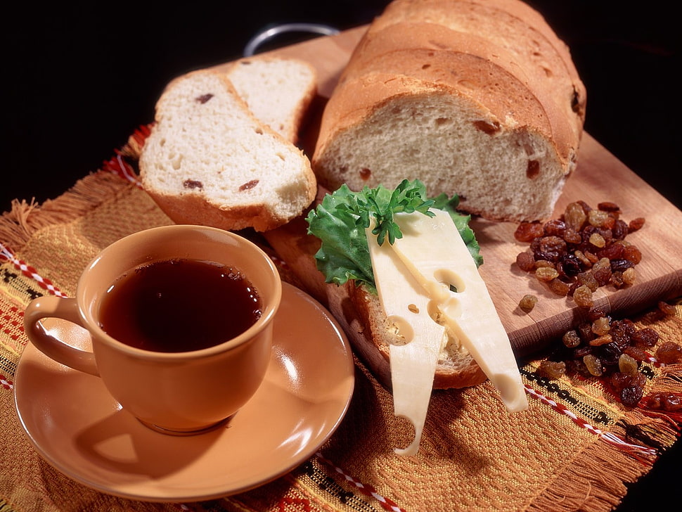 brown ceramic cup with saucer near baked bread HD wallpaper