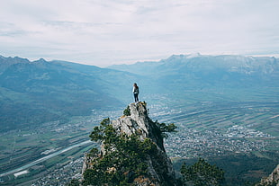woman on top of cliff