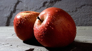 two red Apple fruits HD wallpaper
