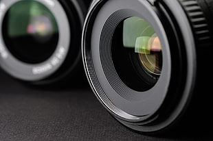 selective focus photography of black camera lens