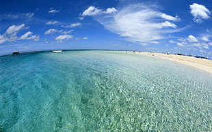 fish-eye photo of clear sea under blue sky during day time