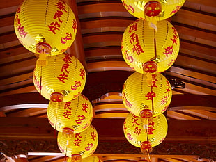 yellow and red kanji script print lamps