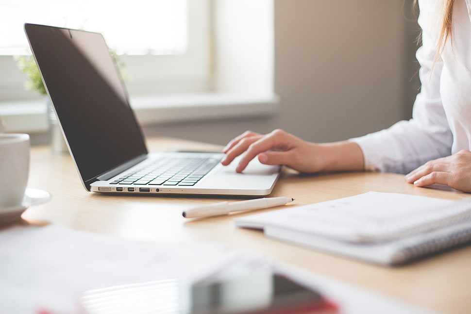 woman using laptop inside office HD wallpaper