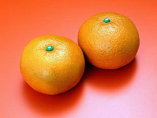 two orange fruit