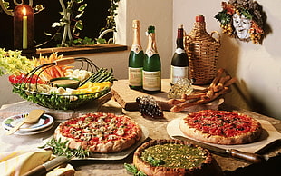 Pizza's and vegetables served