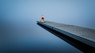 patrick sitting on gray cliff